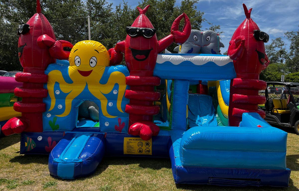 A colored image of a sea-creature themed bounce house.
