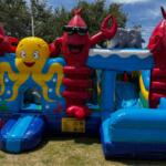 A colored image of a sea-creature themed bounce house.