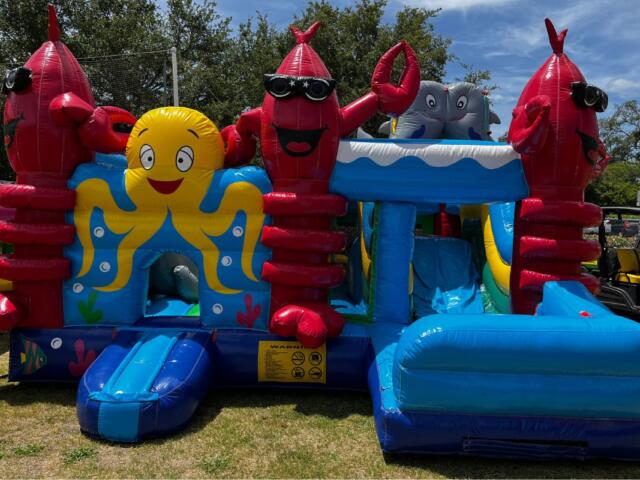 A colored image of a sea-creature themed bounce house.