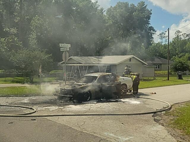 An extinguished car fire.