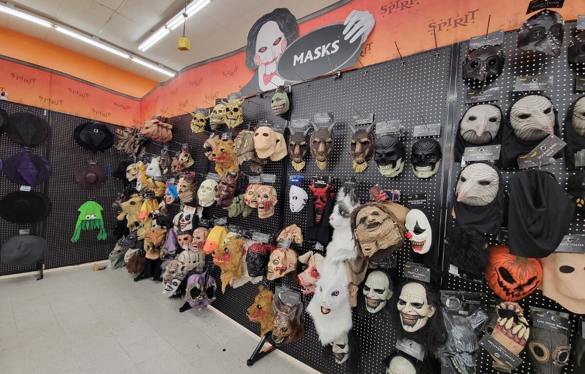 A wall of Halloween masks. 