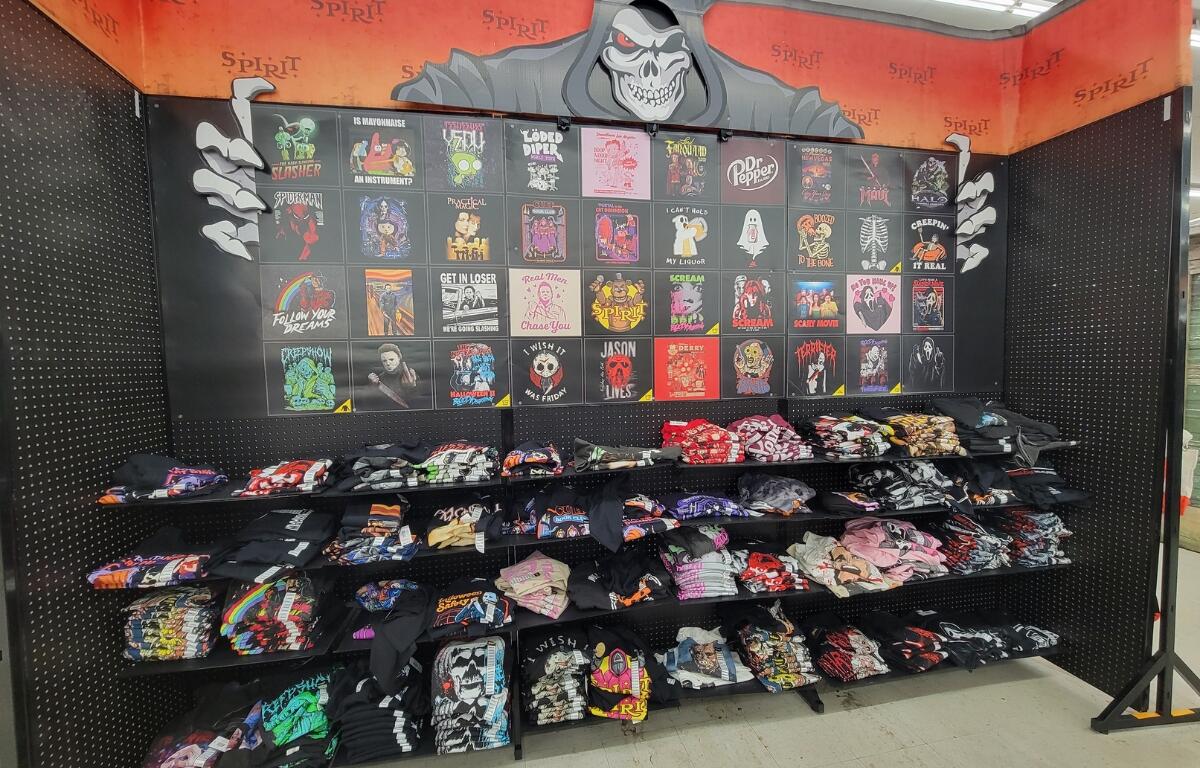 A wall of Halloween-themed apparel.