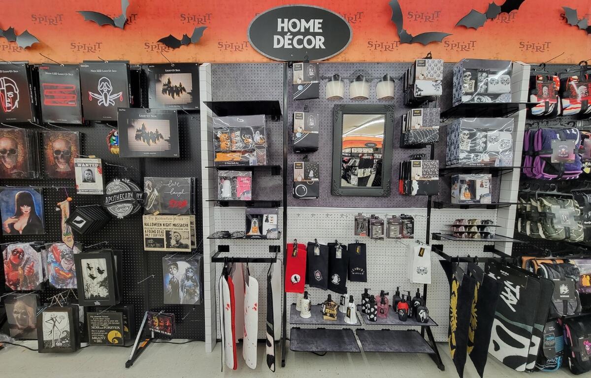 A wall of home decor, including bathroom and bedroom pieces.
