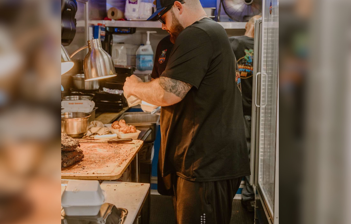 Drew Parson at work in his food truck, Smokey Drews.